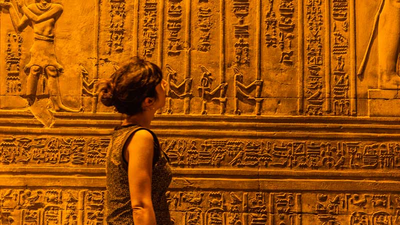 A-fantastic-view-of-a-foreign-tourist-seeing-the-drawings-and-hieroglyphs-in-the-Kom-Ombo-Temple-in-Aswan Egypt Fully Inclusive Holidays